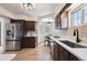 Well-lit kitchen featuring stainless steel appliances, ample counter space, and eat-in breakfast nook at 4434 Grove St, Denver, CO 80211