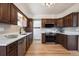 Kitchen featuring stainless steel appliances, wood cabinetry, and ample counter space at 4434 Grove St, Denver, CO 80211