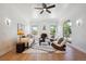 Inviting living room featuring a fireplace, modern decor, hardwood floors, and plenty of natural light at 4434 Grove St, Denver, CO 80211