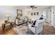 Comfortable living room featuring neutral tones, stylish seating, and ample natural light at 4434 Grove St, Denver, CO 80211