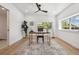 Bright office space with a large window, modern ceiling fan, and stylish rug at 4434 Grove St, Denver, CO 80211