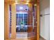 Wooden sauna with a glass door and interior seating at 4434 Grove St, Denver, CO 80211