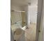 Bathroom with shower/tub combo and tiled floor at 926 Perry St, Denver, CO 80204