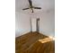 Simple bedroom with hardwood floors and access to another room at 926 Perry St, Denver, CO 80204