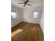 Spacious bedroom with hardwood floors and large windows at 926 Perry St, Denver, CO 80204