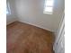 Small bedroom with tile floors and a window at 926 Perry St, Denver, CO 80204