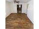 Bright dining room with hardwood floors and view into kitchen at 926 Perry St, Denver, CO 80204