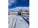 Two-car garage and cozy house exterior in winter setting at 926 Perry St, Denver, CO 80204