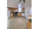 Bright kitchen with wood cabinets and tiled floor at 926 Perry St, Denver, CO 80204