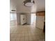 Kitchen with white fridge and access to living room at 926 Perry St, Denver, CO 80204