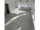 Spacious sunroom with tiled floor and ceiling fan at 926 Perry St, Denver, CO 80204