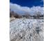 Snow-covered vacant lot, offering endless possibilities at 926 Perry St, Denver, CO 80204