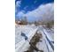Snowy walking path leading through winter landscape at 926 Perry St, Denver, CO 80204