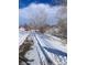 Snowy walking path meandering through winter landscape at 926 Perry St, Denver, CO 80204