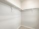 Corner closet with hanging rods and shelving at 13965 Del Corso Way, Broomfield, CO 80020