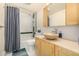 Updated bathroom with vessel sink and walk-in shower at 4980 E Donald Ave # 14, Denver, CO 80222