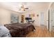 Main bedroom with hardwood floors and access to a patio at 4980 E Donald Ave # 14, Denver, CO 80222