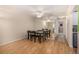 Bright dining area with hardwood floors and mirrored wall at 4980 E Donald Ave # 14, Denver, CO 80222