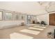 Sunroom with multiple windows and space for fitness equipment at 4980 E Donald Ave # 14, Denver, CO 80222