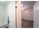 Bright bathroom leading into bedroom with hardwood floors at 2205 S King St, Denver, CO 80219