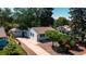 Charming home with a long driveway, detached garage, and well-maintained landscaping at 2205 S King St, Denver, CO 80219