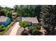 Charming home featuring a long driveway, detached garage, and well-maintained landscaping and lawn at 2205 S King St, Denver, CO 80219