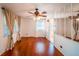 Bright living room with hardwood floors, neutral walls, and ample natural light at 2205 S King St, Denver, CO 80219