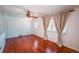 Bright living room with hardwood floors, white walls, and a ceiling fan at 2205 S King St, Denver, CO 80219