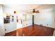Open-concept living area with hardwood floors and a partial view of the kitchen at 2205 S King St, Denver, CO 80219