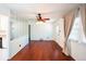 Living room with hardwood floors, a ceiling fan, and a glimpse of the adjoining kitchen at 2205 S King St, Denver, CO 80219
