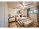 Cozy bedroom featuring hardwood floors, soft lighting, and stylish decor at 2205 S King St, Denver, CO 80219