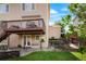 Outdoor area features a raised deck with seating, a small patio, and a tiered garden at 737 Novick Ct, Castle Rock, CO 80109