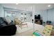 Bright basement with carpeted floors, a sofa, recliner and french doors to outside at 737 Novick Ct, Castle Rock, CO 80109