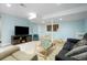 Finished basement featuring modern furniture, a large tv, carpeted floors, and neutral paint at 737 Novick Ct, Castle Rock, CO 80109