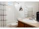 Well-maintained bathroom featuring a tub-shower combo, and a oak-colored vanity at 737 Novick Ct, Castle Rock, CO 80109