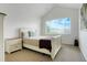 Bright bedroom with vaulted ceiling, neutral walls, and a large window with neighborhood views at 737 Novick Ct, Castle Rock, CO 80109