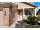Inviting front entrance with brick accents, manicured landscaping, and a charming porch at 737 Novick Ct, Castle Rock, CO 80109