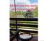 Balcony with outdoor seating and a view of trees and open space at 539 Wright St # 203, Lakewood, CO 80228