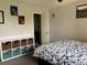 Bright bedroom with an organization cube unit and two colorful art pieces on the wall at 539 Wright St # 203, Lakewood, CO 80228