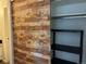 Closet with a sliding barn door and black shelving at 539 Wright St # 203, Lakewood, CO 80228