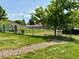 Community garden plot framed by lush green grass and a variety of vegetables at 539 Wright St # 203, Lakewood, CO 80228