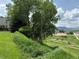 Picturesque community view, with greenery and a glimpse of the distant mountains and sky at 539 Wright St # 203, Lakewood, CO 80228