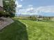 Expansive green space and mountain views from the community lawn area in the distance at 539 Wright St # 203, Lakewood, CO 80228