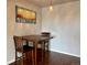 Cozy dining area featuring a wooden table, comfortable seating, and stylish decor at 539 Wright St # 203, Lakewood, CO 80228