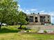 Well maintained condo building with mature landscaping and convenient parking on a sunny day at 539 Wright St # 203, Lakewood, CO 80228