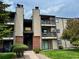 Multi-story building with tidy landscaping showcasing a well-maintained community at 539 Wright St # 203, Lakewood, CO 80228