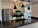 Modern kitchen with stainless steel appliances, sleek countertops, and stylish pendant lighting at 539 Wright St # 203, Lakewood, CO 80228