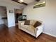 Comfortable living room featuring a sofa, hardwood floors, and an inviting atmosphere at 539 Wright St # 203, Lakewood, CO 80228