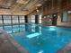 Indoor pool featuring a wooden ceiling and ample sunlight from the windows at 539 Wright St # 203, Lakewood, CO 80228