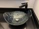 Close-up of a unique fish-shaped vessel sink with black faucet on a black countertop at 539 Wright St # 203, Lakewood, CO 80228